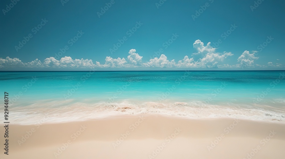 Fototapeta premium Serene Beach with Turquoise Waters and Clear Sky, The serene scene of a beach with gentle turquoise waters under a clear sky invokes a feeling of peace and relaxation.