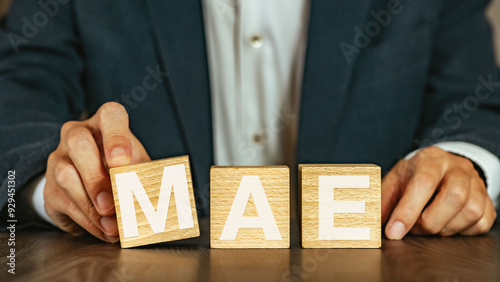 There is wood cube with the word MAE. It is an abbreviation for Mean Absolute Error as eye-catching image. photo