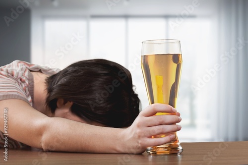 Concept of alcoholism drunk, young man hold glass