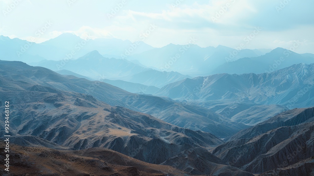 Fototapeta premium Aerial view of mountain ranges from above, with clouds and landscape visible