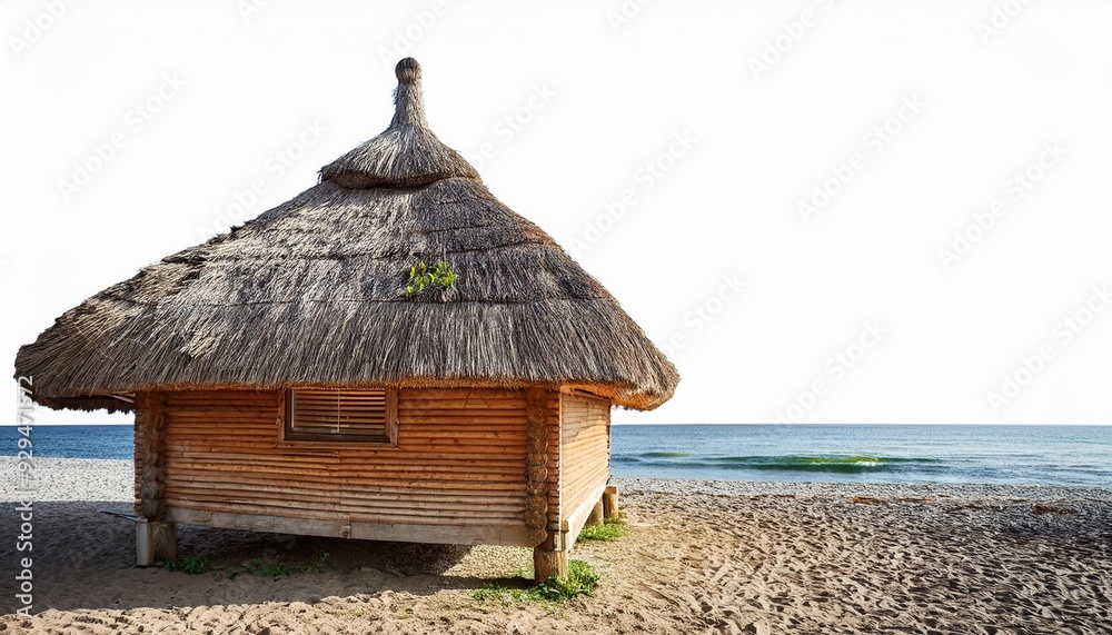 Charming beach hut with a thatched roof, nestled on the sandy shore, overlooking serene ocean waves and a clear sky. Charming beach hut with a thatched roof, nestled on the sandy shore, overlooking serene ocean waves and a clear sky.
