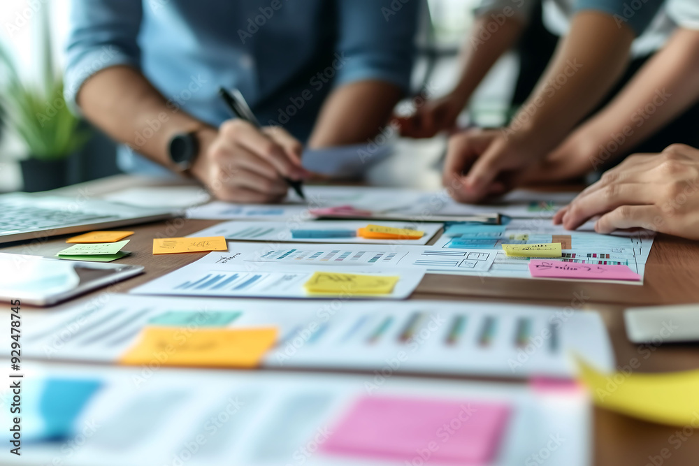 Person organizing and reviewing documents in modern office Person organizing and reviewing documents in modern office