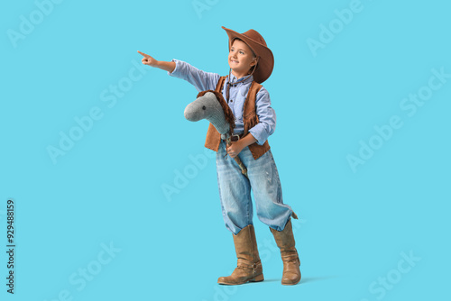Cute little cowboy with toy...