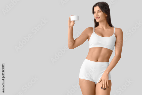 Young woman in underwear wi...