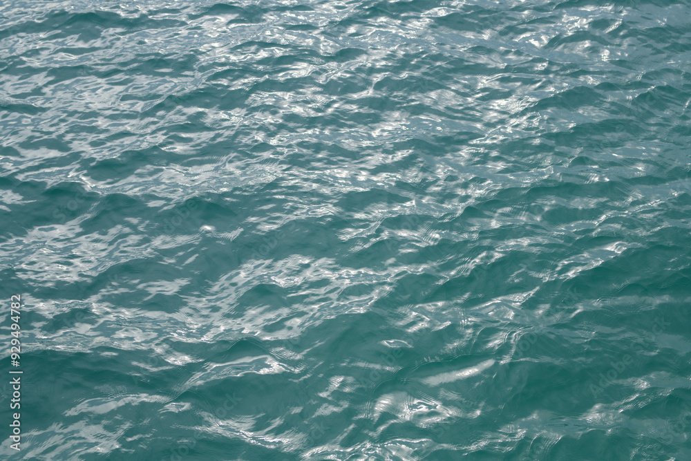 Abstract blue sea water. Background texture. Water in swimming pool or sea. Rippled water detail background. Blue sea surface. Abstract blue sea water. Background texture. Water in swimming pool or sea. Rippled water detail background. Blue sea surface.