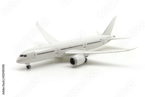Model of a white airplane on a white surface