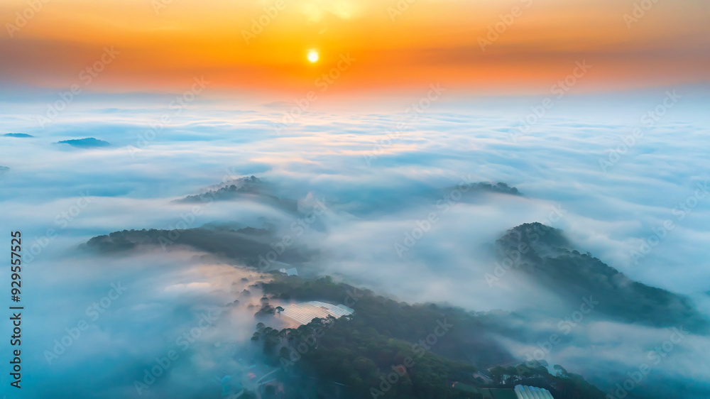 Obraz premium Aerial view of Xuan Tho suburbs near Da Lat city at morning with misty and sunrise sky. This place is considered most beautiful and peaceful place to watch sunrise in highlands of Vietnam