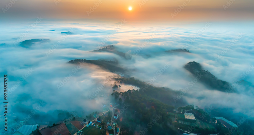 Obraz premium Aerial view of Xuan Tho suburbs near Da Lat city at morning with misty and sunrise sky. This place is considered most beautiful and peaceful place to watch sunrise in highlands of Vietnam