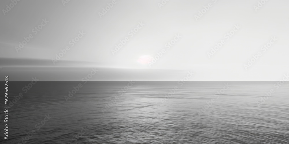 A serene black and white photo of the ocean waves crashing against the shore A serene black and white photo of the ocean waves crashing against the shore