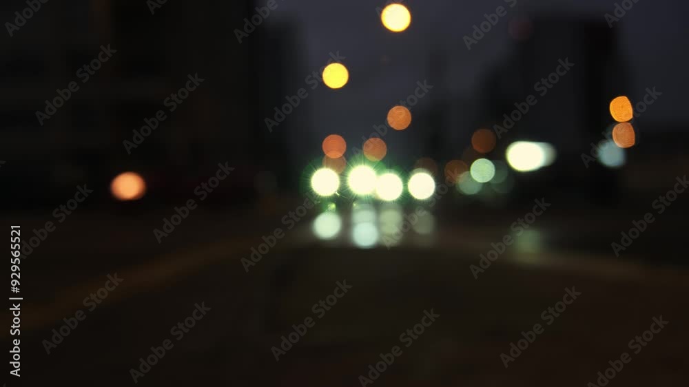Night road lights blurred bokeh of cars in traffic on the road at night. Abstract bright blurred colored bokeh. Bokeh lights in the city night background Night road lights blurred bokeh of cars in traffic on the road at night. Abstract bright blurred colored bokeh. Bokeh lights in the city night background