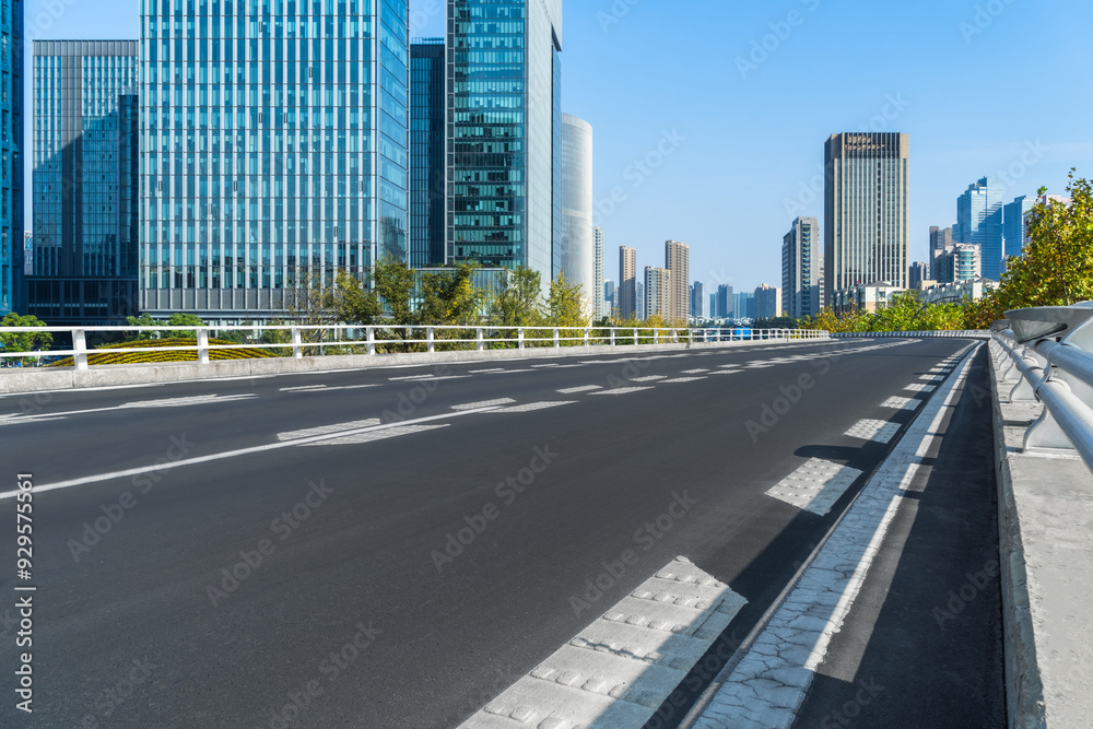 city empty traffic road with cityscape in background city empty traffic road with cityscape in background