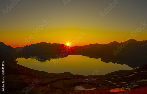 Jilin Province, China - June 23, 2019: Morning and sunrise view of Cheonji Lake at Baekdusan Mountain in summer photo