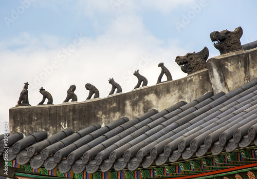 Jung-gu, Seoul, South Korea - April 1 2022: Low angle view of tile roof and Jabsang(decorative tile of various gods) on top of Seokeodang Hall at Deoksugung Palace photo