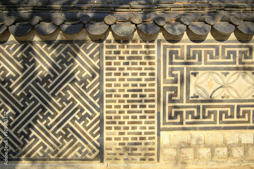 Jongno-gu, Seoul, South Korea - April 15, 2022: Spring view of a wall with tile roof and patterns at Unhyeongung Palace