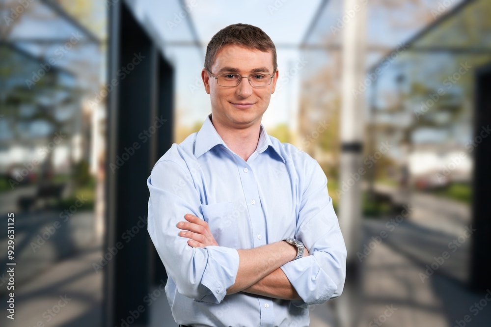 Proud portrait of businessman near office. Proud portrait of businessman near office.