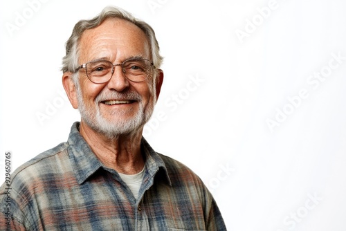 Half body shot of an elderly male presenter with a friendly smile, dressed in a casual shirt, standing in front of a solid white background