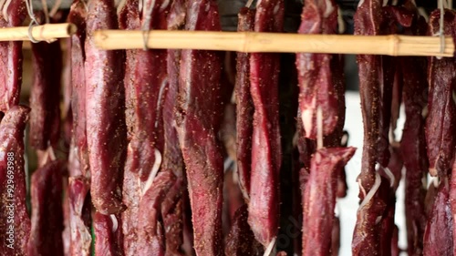 Fan dried biltong South African traditional venison meat jerky rotating on wheel photo