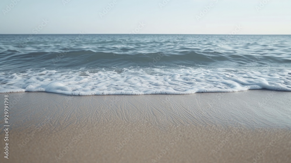 Front view of a peaceful shore where the waves gently lap against the sand, offering a sense of calm and relaxation, ideal for those seeking solace by the sea. Front view of a peaceful shore where the waves gently lap against the sand, offering a sense of calm and relaxation, ideal for those seeking solace by the sea.