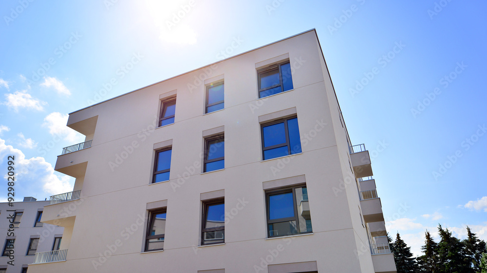 Fototapeta premium Modern architecture of urban residential apartment buildings on a sunny day. Facade of a modern apartment building.