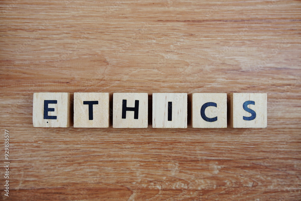 ETHICS alphabet letters top view on wooden background ETHICS alphabet letters top view on wooden background