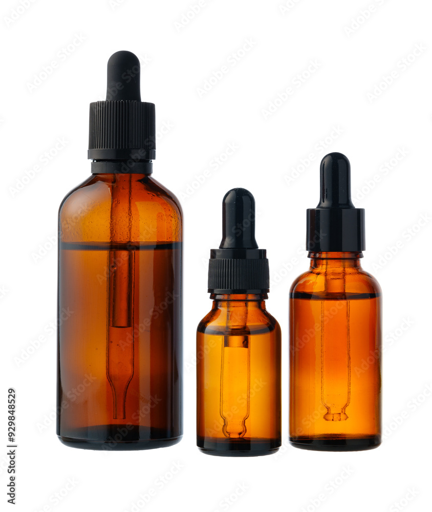 Amber Glass Bottles With Droppers and Jars on White Background Amber Glass Bottles With Droppers and Jars on White Background