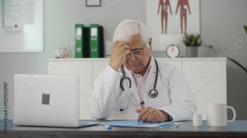 Stressed and tensed Indian senior doctor