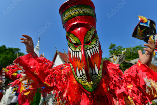 Phi ta khon (ghost festival) is a famous Thailand festival followed from one of Buddhist legend, Maha Vessantara Jataka. One who join have to waring the colorful ghost costume and dance in the parade. photo