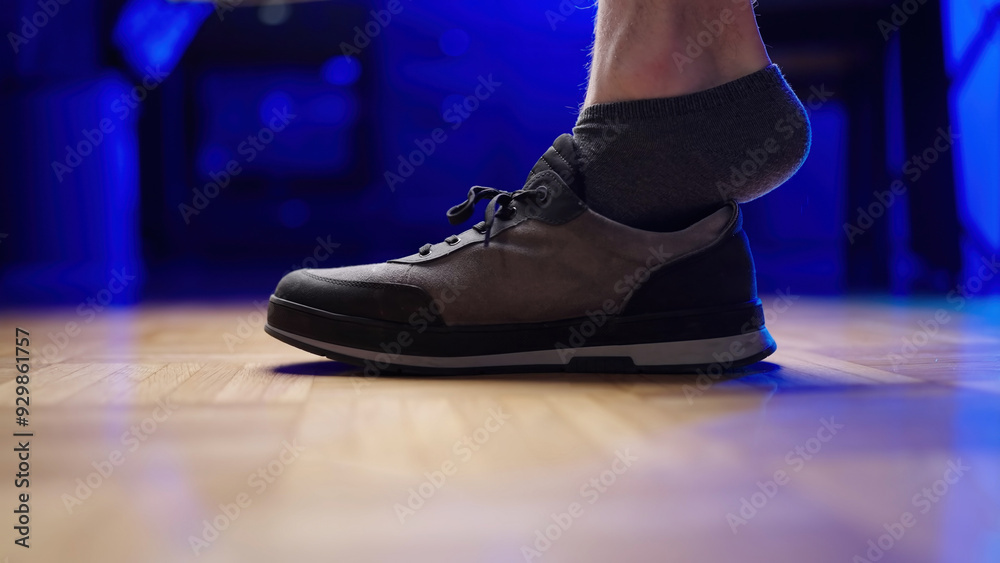 Put on shoe with gray sock foot inside Put on shoe with gray sock foot inside