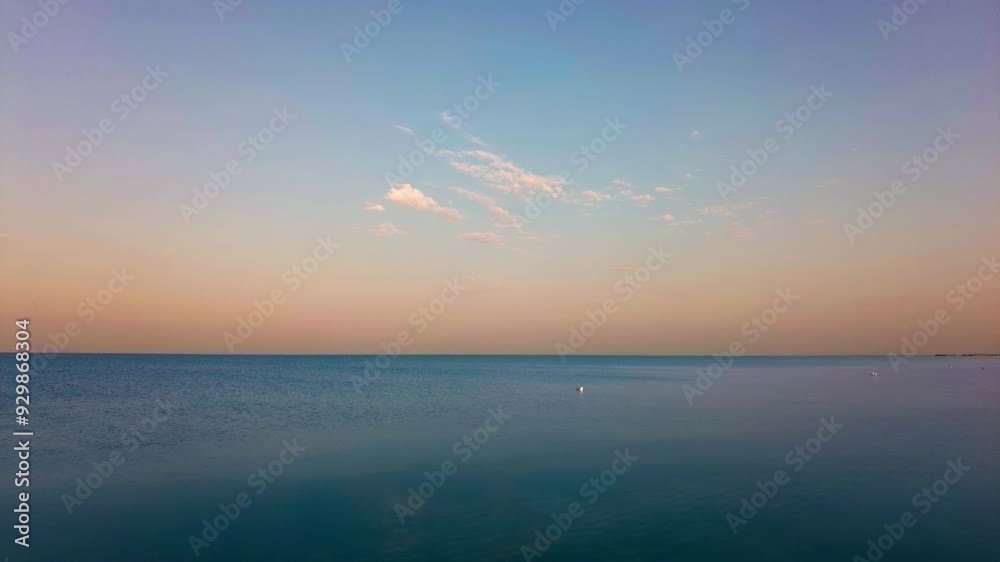 Orange Sunrise Over a Tranquil Sea Orange Sunrise Over a Tranquil Sea
