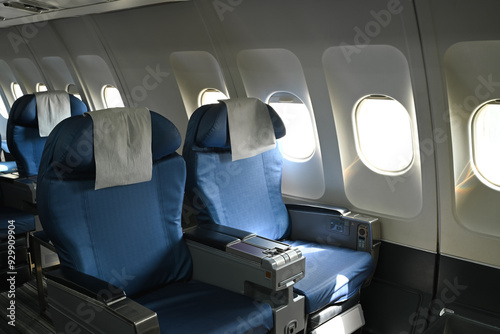 Airplane interior. Empty passenger seats in an airplane cabin