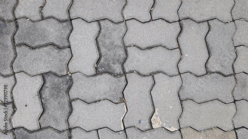 Texture image of gray brick floor.Gray paving slabs urban street road floor stone tile texture background. photo