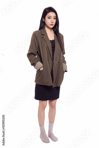 Young beautiful oriental woman in suit in front of white background White background