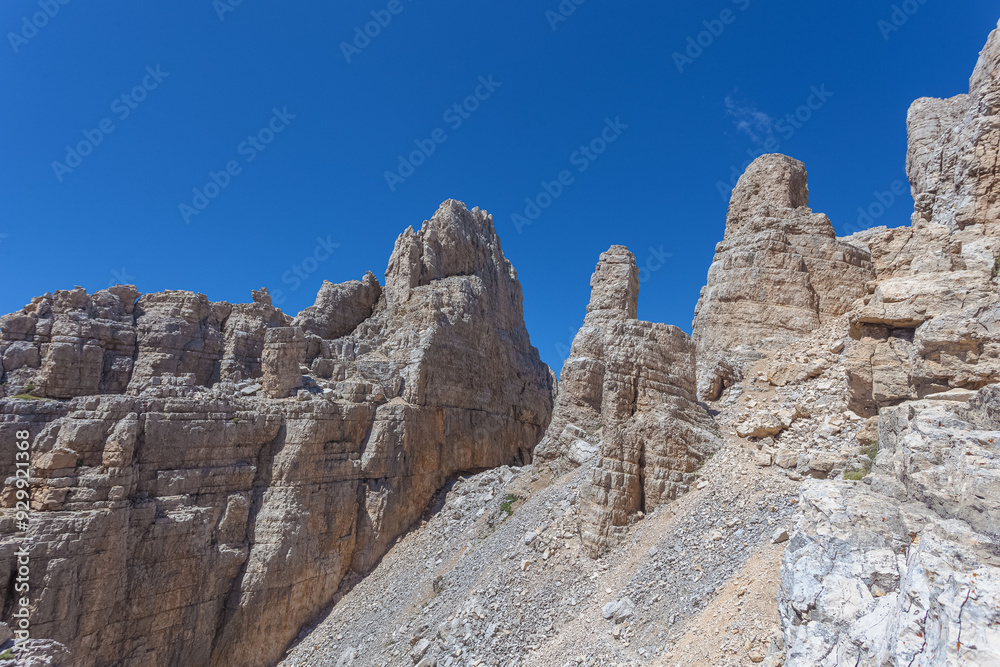 Fototapeta premium The Torre di Pisa rock pinnacle in the Latemar Massif, UNESCO world heritage site. Trentino-Alto Adige, Italy, Europe