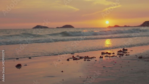 Sand and Waves on sunset beach.