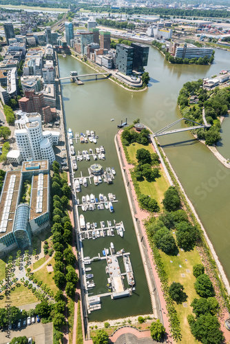 High top panoramic wide angle view of city buildings, river and media harbour from Dusseldorf Rhine Tower in North Rhine-Westphalia, Germany