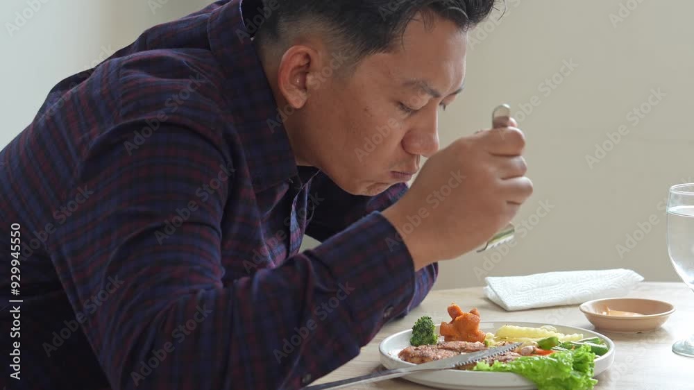 Happy Asian Man Enjoying Eating Chicken Steak With Satisfaction Feeling Happy Asian Man Enjoying Eating Chicken Steak With Satisfaction Feeling