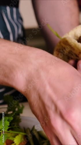 Fresh fried falafel in pita, vertical video