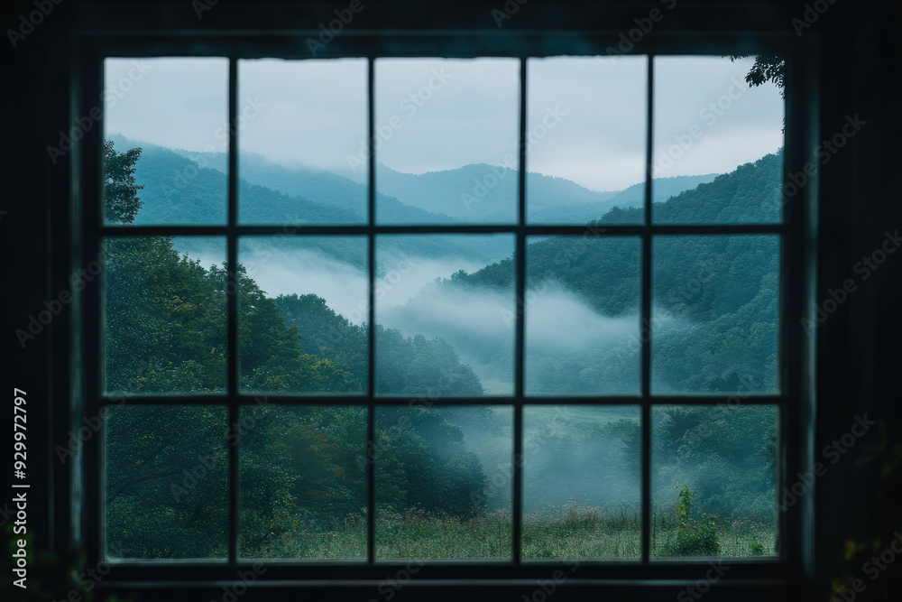 Fototapeta premium Tranquil Fog Envelops a Valley Viewed Through a Picture Window