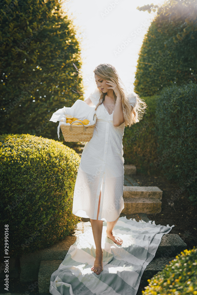 photo in Italian style with a sexy young woman in a light summer dress a peasant woman picking fruits