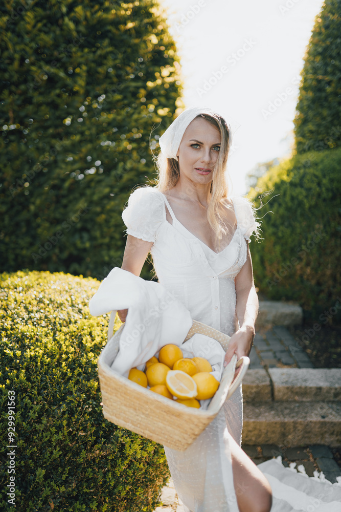 photo in Italian style with a sexy young woman in a light summer dress a peasant woman picking fruits