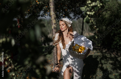 Obraz na płótnie photo in Italian style with a sexy young woman in a light summer dress a peasant woman picking fruits w salonie