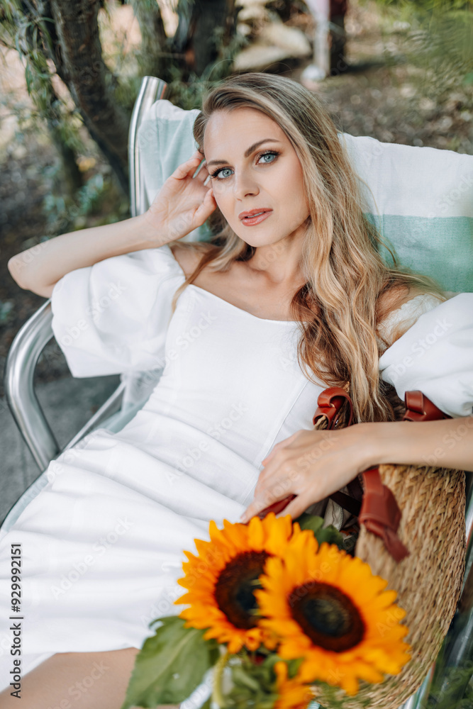 photo in Italian style with a sexy young woman in a light summer dress a peasant woman picking fruits