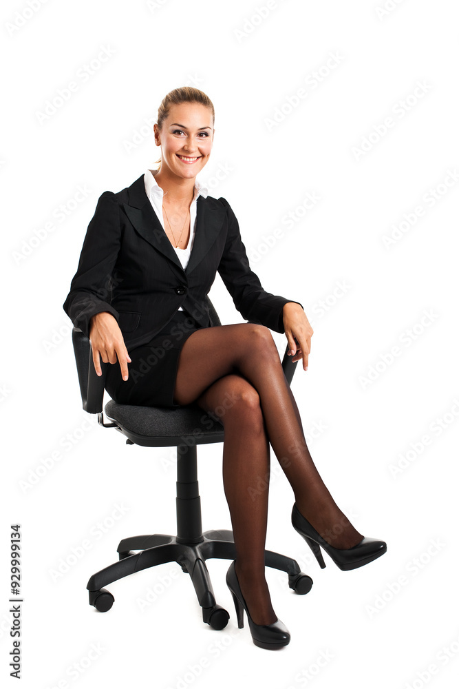 Confident businesswoman seated in office chair Confident businesswoman seated in office chair