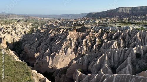 Aerial footage of the scenic rocky Red Valley on a clear sunny day in Cappadocia, Turkiye