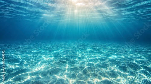 Fototapeta Naklejka Na Ścianę i Meble -  Tranquil sea water surface on a sunny day, Underwater sea in sunlight, tropical blue ocean underwater background