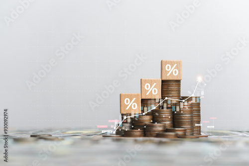 Photos Stack of silver coins with up arrow