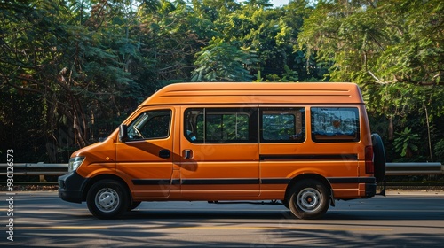 A seven-seat orange commercial vehicle seen at an angle.