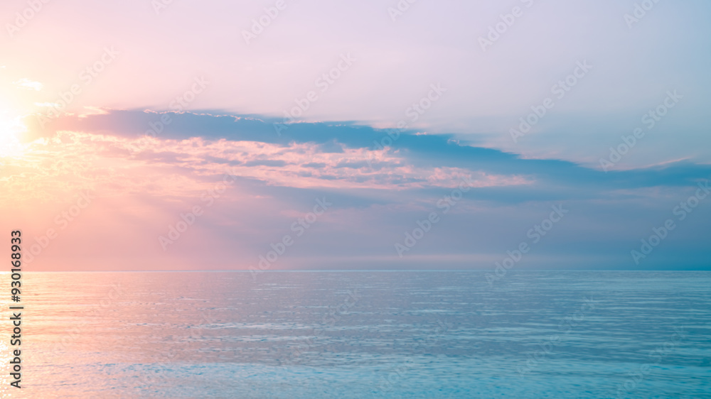 Fototapeta premium Beautiful gentle and delicate pink sunrise on the sea, sky with clouds, natural delicate background
