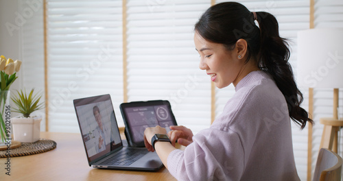 Bild auf Leinwand Asia people young woman video call talk chat help guide online at home by AI tele consult telehealth telemedicine app clinic in IoT device collect ECG data heart pulse sleep rate on cloud computing