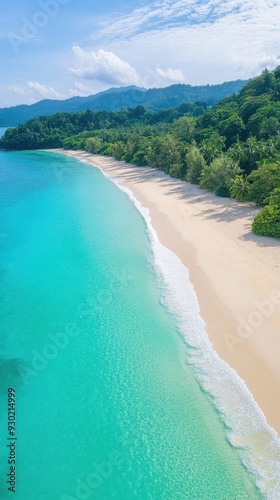 An aerial view of a tropical beach with turquoise waters gently lapping at the shore, surrounded by lush green vegetation